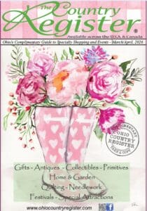 Snowman wearing a hat and scarf.